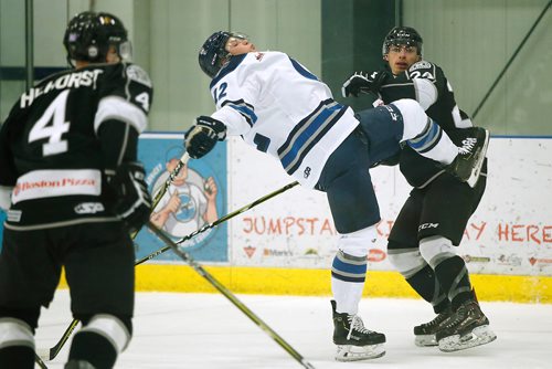 JOHN WOODS / WINNIPEG FREE PRESS
Steinbach Pistons' Max Neill (12) is checked by Neepawa Natives' Noah Carson (24) at Seven Oaks Sportsplex Monday, December 10, 2018.