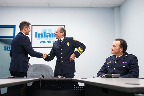 MIKAELA MACKENZIE / WINNIPEG FREE PRESS
Mayor Brian Bowman (left), Winnipeg Fire & Paramedic Service Chief John Lane, and Winnipeg Police Chief Danny Smyth prepare to videoconference with the parliamentary Standing Committee on Health, which is currently studying the impacts of methamphetamine abuse in Canada, at Inland AV in Winnipeg on Tuesday, Dec. 11, 2018. 
Winnipeg Free Press 2018.