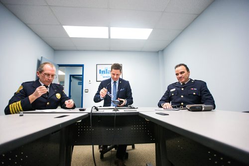 MIKAELA MACKENZIE / WINNIPEG FREE PRESS
Winnipeg Fire & Paramedic Service Chief John Lane (left), Mayor Brian Bowman, and Winnipeg Police Chief Danny Smyth prepare to videoconference with the parliamentary Standing Committee on Health, which is currently studying the impacts of methamphetamine abuse in Canada, at Inland AV in Winnipeg on Tuesday, Dec. 11, 2018. 
Winnipeg Free Press 2018.