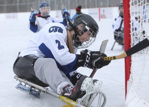 RUTH BONNEVILLE / WINNIPEG FREE PRESS


Kassidy Paluck a member of the Collège Jeanne-Sauvé hockey team plays sledge hockey with her teammates on the newly opened fully accessible Jumpstart outdoor rink at Dakota Community Centre Tuesday. 
See press release for more info.




Dec 11th, 2018