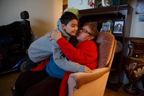 MIKE DEAL / WINNIPEG FREE PRESS
A distraught Sherry Kubica is hugged by her grandson, Adrian, in her home in East Kildonan. Her daughter and Adrian's mother, Lisa Marie Kubica, was killed in a homicide at her Gilbert Park home over the weekend.
181212 - Wednesday, December 12, 2018.