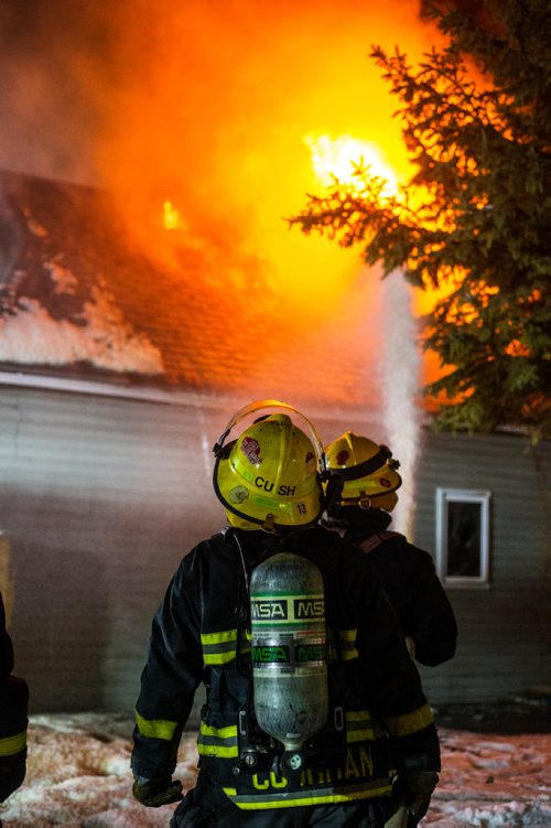 MIKAELA MACKENZIE / WINNIPEG FREE PRESS
Firefighters work to put out a house fire On Stella Ave between Parr and McKenzie streets around midnight in Winnipeg on Saturday, Dec. 14, 2018. 
Winnipeg Free Press 2018.