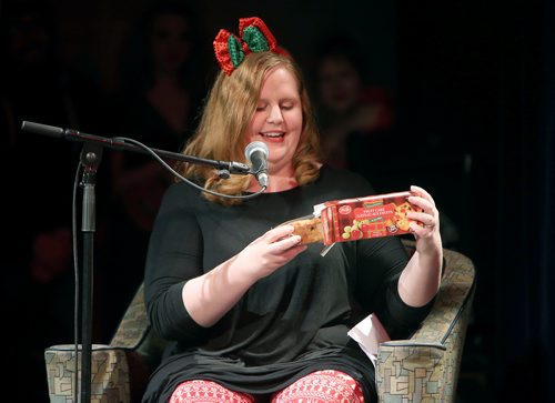 JASON HALSTEAD / WINNIPEG FREE PRESS

Winnipeg Free Press writer Erin Lebar breaks out the fruit cake at the Free Press Bury the Lede Live: A Holiday Podcast Spectacular event at the West End Cultural Centre on Dec. 16, 2018. The event raised funds for Miracle on Mountain, the Free Press fundraising campaign in support of the Christmas Cheer Board.