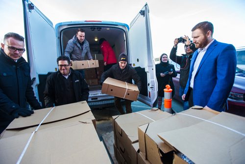 MIKAELA MACKENZIE / WINNIPEG FREE PRESS
Crown Auto Group and Granny's representatives haul in $30,000 worth of turkeys to the Christmas Cheer Board in Winnipeg on Monday, Dec. 17, 2018. 
Winnipeg Free Press 2018.