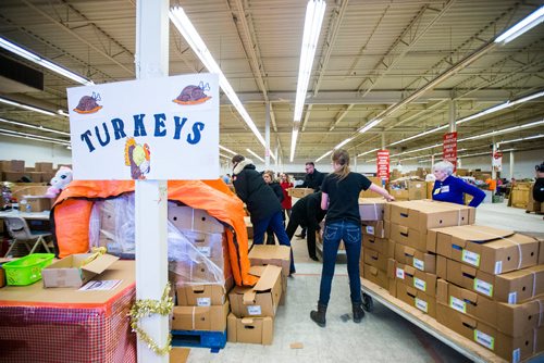 MIKAELA MACKENZIE / WINNIPEG FREE PRESS
Crown Auto Group and Granny's representatives haul in $30,000 worth of turkeys to the Christmas Cheer Board in Winnipeg on Monday, Dec. 17, 2018. 
Winnipeg Free Press 2018.