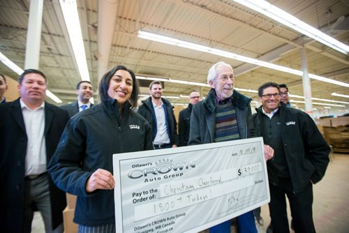 MIKAELA MACKENZIE / WINNIPEG FREE PRESS
Dhiya Dilawri, VP of strategy and business development at Crown Auto Group (left), and Kai Madsen, executive director of the Christmas Cheer Board, hold a novelty cheque for $30,000 worth of turkeys with other Crown Auto Group representatives at the Christmas Cheer Board in Winnipeg on Monday, Dec. 17, 2018. 
Winnipeg Free Press 2018.