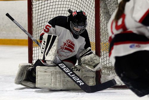 PHIL HOSSACK / WINNIPEG FREE PRESS - SPORTS AGATE- Dakota Clipper goalie #35 Lydia Adamus  looks for the puck as it bounces of the goal post behind her head in action at the Corydon Community Centre Monday afternoon. - December 17, 2018
