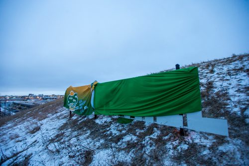 MIKAELA MACKENZIE / WINNIPEG FREE PRESS
The Garbage Hill sign is wrapped up before the unveiling at Westview Park in Winnipeg on Thursday, Dec. 20, 2018. 
Winnipeg Free Press 2018.