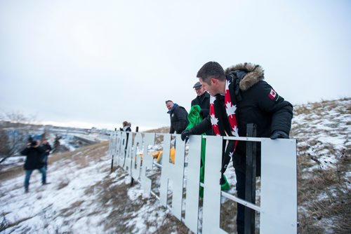 MIKAELA MACKENZIE / WINNIPEG FREE PRESS
Mayor Brian Bowman checks out the new Garbage Hill sign after unveiling it at West View Park in Winnipeg on Thursday, Dec. 20, 2018. 
Winnipeg Free Press 2018.