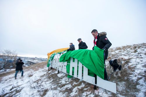 MIKAELA MACKENZIE / WINNIPEG FREE PRESS
Mayor Brian Bowman, along with President of SRS Signs and Service Inc. Shane Storie (left) and city councillor Scott Gillingham, unveil the new Garbage Hill sign at West View Park in Winnipeg on Thursday, Dec. 20, 2018. 
Winnipeg Free Press 2018.