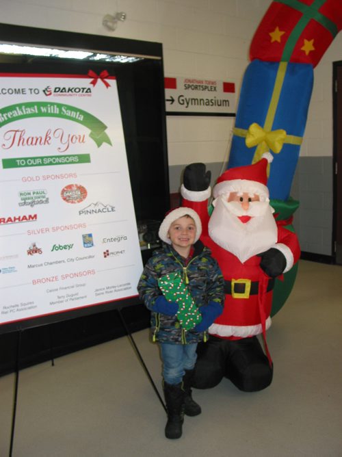 Canstar Community News Dec. 8, 2018 - Young guests at the Dakota Community Centre's Santa Breakfast on Dec. 8 were given a gift along with breakfast and a chance to visit with Santa and Mrs. Claus, decorate cookies and watch an entertainer. (ANDREA GEARY/CANSTASR COMMUNITY NEWS)