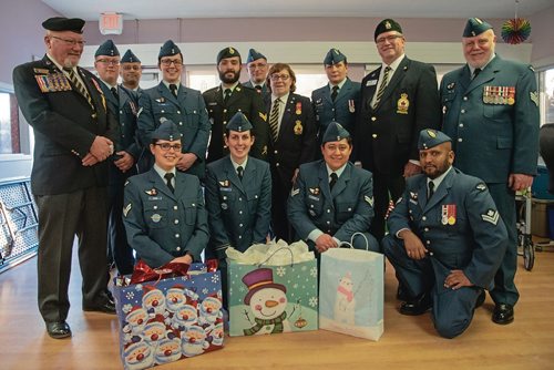 Canstar Community News Dec. 11 - Members from 17 Wing and the Charleswood Legion dropped off gifts to veterans at Tuxedo Villa Extendicare on Mon., Dec. 10. (EVA WASNEY/CANSTAR COMMUNITY NEWS/METRO)