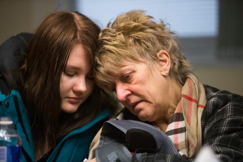 MIKAELA MACKENZIE / WINNIPEG FREE PRESS
Mikayla Harris (left) and Linda Kruger comfort each other as the family holds a press conference at the Grace Hospital after their home burned down just days before Christmas in Winnipeg on Friday, Dec. 21, 2018. 
Winnipeg Free Press 2018.
On December 20, 2018, at 1:20 am, Headingley RCMP received a report of a house fire on Park Avenue in Oak Bluff, Manitoba.