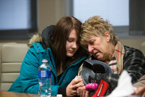 MIKAELA MACKENZIE / WINNIPEG FREE PRESS
Mikayla Harris (left) and Linda Kruger comfort each other as the family holds a press conference at the Grace Hospital after their home burned down just days before Christmas in Winnipeg on Friday, Dec. 21, 2018. 
Winnipeg Free Press 2018.
On December 20, 2018, at 1:20 am, Headingley RCMP received a report of a house fire on Park Avenue in Oak Bluff, Manitoba.