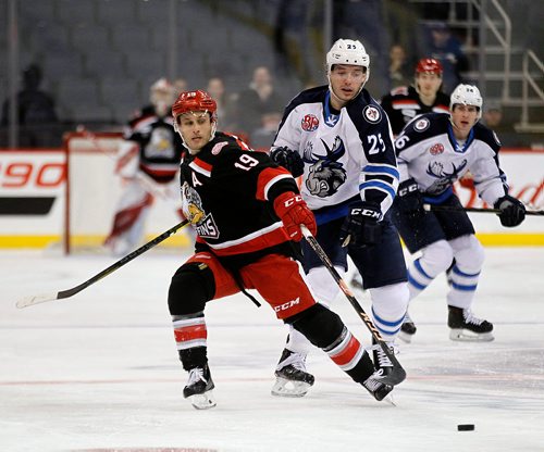 PHIL HOSSACK / WINNIPEG FREE PRESS - Manitoba Moose # 25 Marko Dano stops a breakaway attempt by Grnd Rapids Griffins' #19 Carter Camper. December 21, 2018.