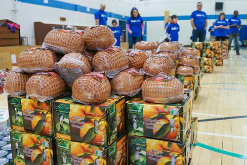 Katie McKenzie / Ma Mawi Wi Chi Itata Centre
Hams and oranges waiting to be packed into hampers at R. B. Russell School for the 16th annual Christmas Hamper Drive hosted by Ma Mawi Wi Chi Itata Centre and Bell MTS.

181222 - Saturday, December 22, 2018.