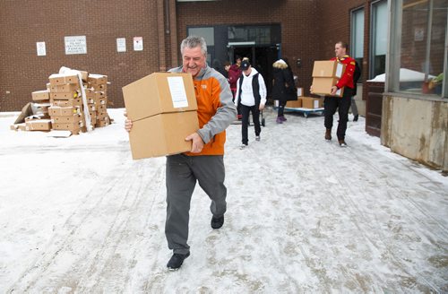 MIKE DEAL / WINNIPEG FREE PRESS
Angus MacKinnon carries boxes of hampers to his car for delivery at R. B. Russell School for the 16th annual Christmas Hamper Drive hosted by Ma Mawi Wi Chi Itata Centre and Bell MTS.
181222 - Saturday, December 22, 2018.