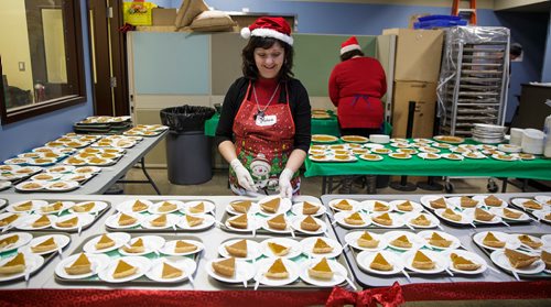 MIKE DEAL / WINNIPEG FREE PRESS
The Siloam Mission Christmas Eve meal serves over 600 people with anywhere from 65-100 volunteers to help make it happen on Monday December 24, 2018.
Volunteer Melanie Wesa getting the pumpkin pies ready just before service begins at noon.
181224 - Monday, December 24, 2018.