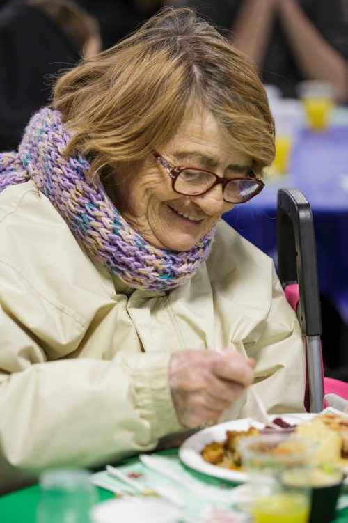 MIKE DEAL / WINNIPEG FREE PRESS
The Siloam Mission Christmas Eve meal serves over 600 people with anywhere from 65-100 volunteers to help make it happen on Monday December 24, 2018.
Carroll Caron digs into her turkey dinner.
181224 - Monday, December 24, 2018.