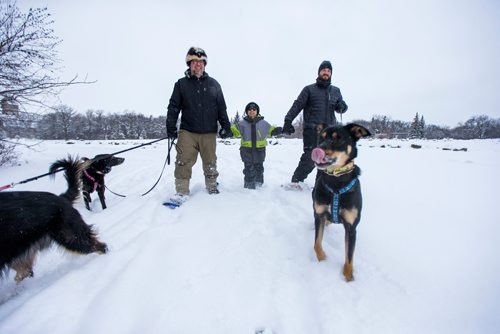 MIKAELA MACKENZIE / WINNIPEG FREE PRESS
Kevin Roberts (left) and André Lavergne go snowshoeing with their son, Sam O. (11), in Assiniboine Park after Sam got new snowshoes for Christmas in Winnipeg on Tuesday, Dec. 25, 2018. 
Winnipeg Free Press 2018.