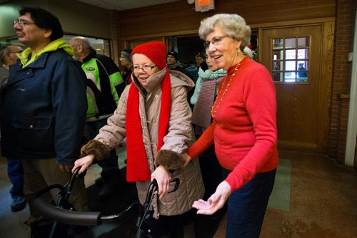 MIKAELA MACKENZIE / WINNIPEG FREE PRESS
Helen Patterson (right) welcomes Lorraine Ulasz to the annual Christmas lunch hosted by the West Broadway Community Ministry and Shaarey Zedek at Crossways in Common in Winnipeg on Tuesday, Dec. 25, 2018. 
Winnipeg Free Press 2018.