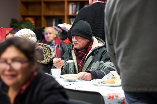 MIKAELA MACKENZIE / WINNIPEG FREE PRESS
Reg Freeman eats at the annual Christmas lunch hosted by the West Broadway Community Ministry and Shaarey Zedek at Crossways in Common in Winnipeg on Tuesday, Dec. 25, 2018. 
Winnipeg Free Press 2018.