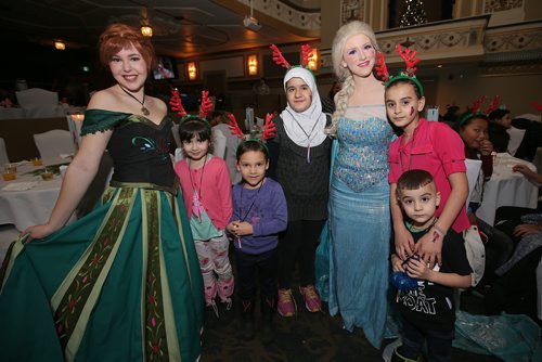 JASON HALSTEAD / WINNIPEG FREE PRESS

Frozen characters Princess Anna and Princess Elsa from Heather's Pretty Parties with youngsters (from second left) Isabella, 7, Addison, 6, Zahraa, 11, Eman, 10, and Rebar, 3, at Winter Wonderland  Variety Childrens Holiday Celebration hosted by Variety, the Children's Charity of Manitoba, on Dec. 10, 2018 at the Metropolitan Event Centre. (See Social Page)