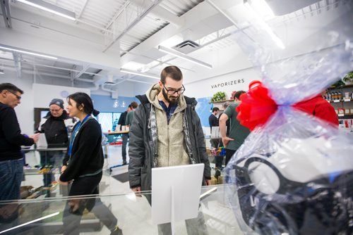 MIKAELA MACKENZIE / WINNIPEG FREE PRESS
Nick Corsaro shops on Boxing Day at the Delta 9 cannabis store in Winnipeg on Wednesday, Dec. 26, 2018. 
Winnipeg Free Press 2018.