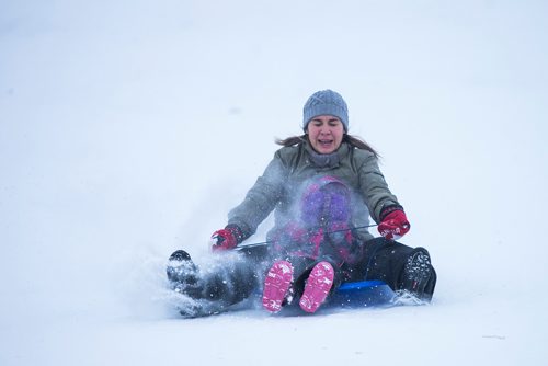 MIKAELA MACKENZIE / WINNIPEG FREE PRESS
Nadia Orellana and her daughter, Rebeka Concha, toboggan at West View Park in Winnipeg on Wednesday, Dec. 26, 2018. 
Winnipeg Free Press 2018.