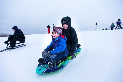 MIKAELA MACKENZIE / WINNIPEG FREE PRESS
Everett (six) and Nathan (11) Esch toboggan at West View Park in Winnipeg on Wednesday, Dec. 26, 2018. 
Winnipeg Free Press 2018.