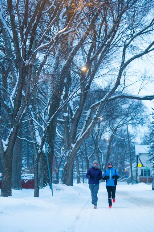 MIKAELA MACKENZIE / WINNIPEG FREE PRESS
Naomi Brodland (left) and Elle Keinitz run down Wolselsey Avenue after a fresh dump of snow overnight in Winnipeg on Thursday, Dec. 27, 2018. 
Winnipeg Free Press 2018.