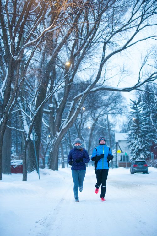 MIKAELA MACKENZIE / WINNIPEG FREE PRESS
Naomi Brodland (left) and Elle Keinitz run down Wolselsey Avenue after a fresh dump of snow overnight in Winnipeg on Thursday, Dec. 27, 2018. 
Winnipeg Free Press 2018.