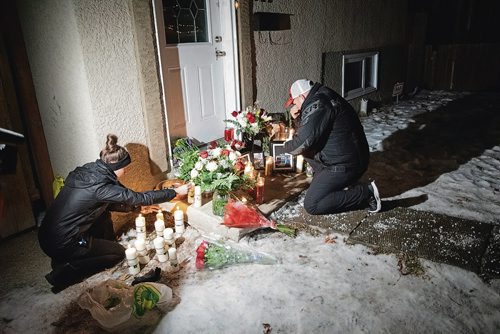 Canstar Community News Dec. 20 - More than 100 people gathered on Dec. 20 for a vigil in memory of Ricardo Hibi, who was killed on Monday at the group home he operated at 622 McGee St. (EVA WASNEY/CANSTAR COMMUNITY NEWS/METRO)