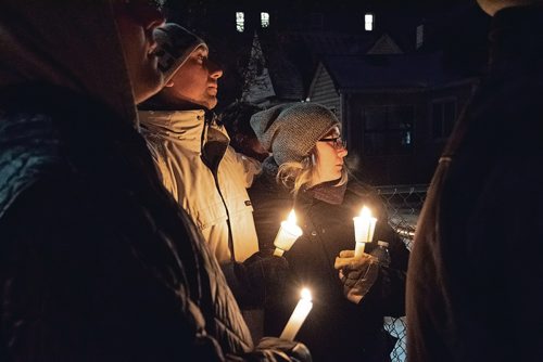 Canstar Community News Dec. 20 - More than 100 people gathered on Dec. 20 for a vigil in memory of Ricardo Hibi, who was killed on Monday at the group home he operated at 622 McGee St. (EVA WASNEY/CANSTAR COMMUNITY NEWS/METRO)