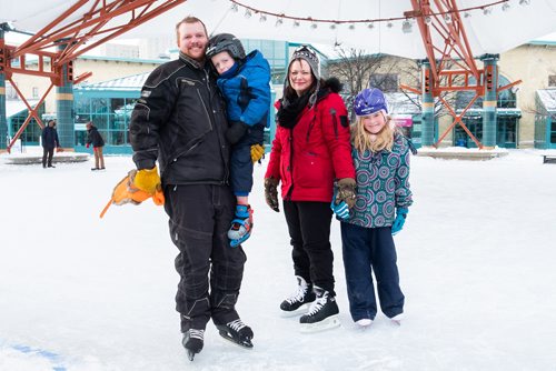 Daniel Crump / Winnipeg Free Press. Isaac (left) and Becky (middle right) Milne braved -30ºC weather at the Forks to take a skate with their kids Jaylyn (right) and Matt (middle left). December 29, 2018.