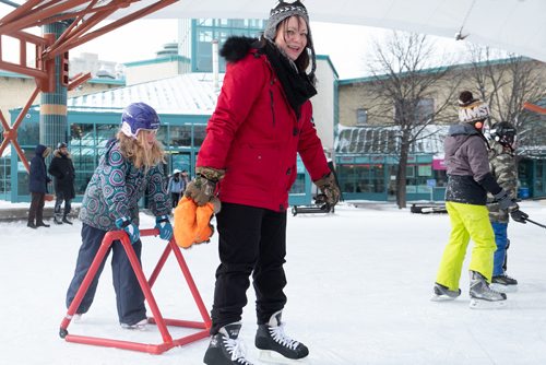 Daniel Crump / Winnipeg Free Press. Becky Milne (middle) skates with her daughter, Jaylyn (right). Jaylyn received her first pair of skates for Christmas this year, and braved the -30ºC weather to skate on the skating trail at the Forks. December 29, 2018.