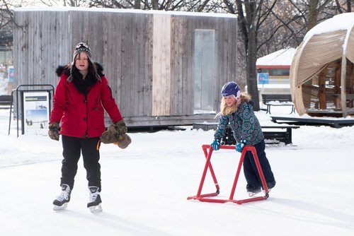 Daniel Crump / Winnipeg Free Press. Becky Milne (middle) skates with her daughter, Jaylyn (right). Jaylyn received her first pair of skates for Christmas this year, and braved the -30ºC weather to skate on the skating trail at the Forks. December 29, 2018.