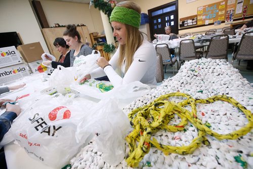 JOHN WOODS / WINNIPEG FREE PRESS
Tessa Blaikie Whitecloud, executive director of 1JustCity, makes blankets and sleeping mats out of plastic shopping bags with volunteers for people living on the streets at Oak Table Sunday, December 30, 2018. On Tuesday Just a Warm Sleep will open to offer up to 25 people a safe place to sleep.