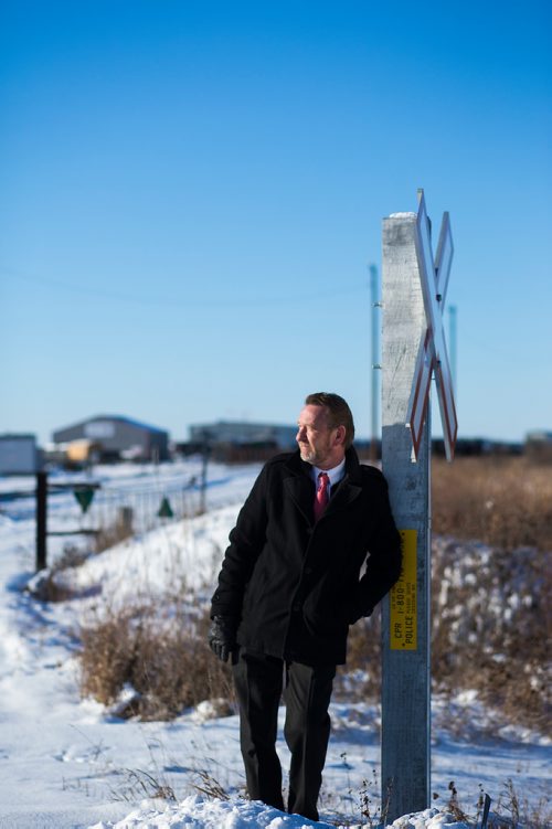 MIKAELA MACKENZIE / WINNIPEG FREE PRESS
Neil Greenslade, a Winnipegger who served as assistant superintendent with Canadian Pacific for three decades, poses by the tracks in Winnipeg on Monday, Dec. 31, 2018. 
Winnipeg Free Press 2018.