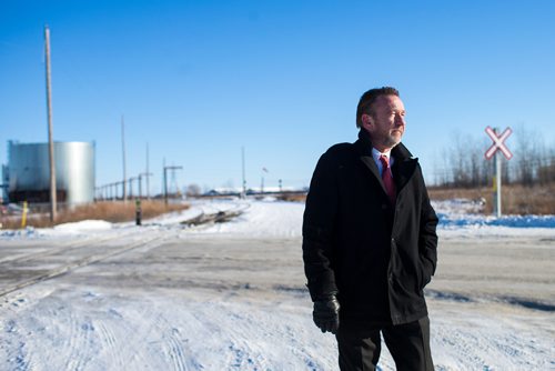 MIKAELA MACKENZIE / WINNIPEG FREE PRESS
Neil Greenslade, a Winnipegger who served as assistant superintendent with Canadian Pacific for three decades, poses by the tracks in Winnipeg on Monday, Dec. 31, 2018. 
Winnipeg Free Press 2018.