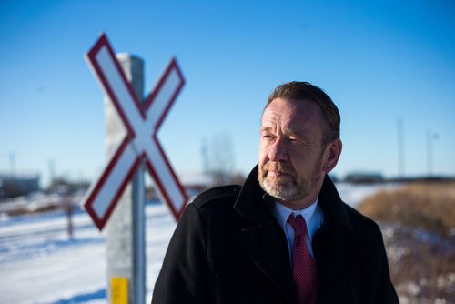 MIKAELA MACKENZIE / WINNIPEG FREE PRESS
Neil Greenslade, a Winnipegger who served as assistant superintendent with Canadian Pacific for three decades, poses by the tracks in Winnipeg on Monday, Dec. 31, 2018. 
Winnipeg Free Press 2018.