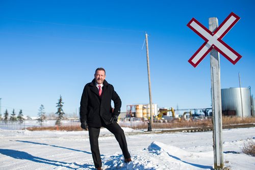 MIKAELA MACKENZIE / WINNIPEG FREE PRESS
Neil Greenslade, a Winnipegger who served as assistant superintendent with Canadian Pacific for three decades, poses by the tracks in Winnipeg on Monday, Dec. 31, 2018. 
Winnipeg Free Press 2018.