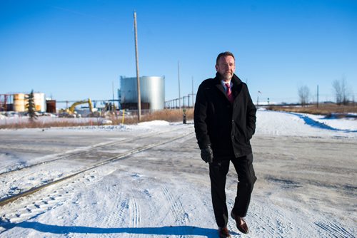 MIKAELA MACKENZIE / WINNIPEG FREE PRESS
Neil Greenslade, a Winnipegger who served as assistant superintendent with Canadian Pacific for three decades, poses by the tracks in Winnipeg on Monday, Dec. 31, 2018. 
Winnipeg Free Press 2018.