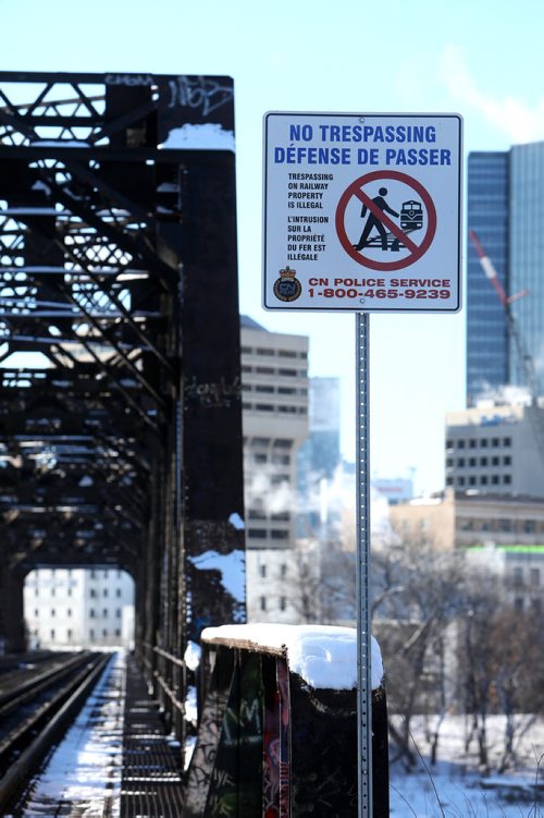 RUTH BONNEVILLE / WINNIPEG FREE PRESS

49.8 - rail safety feature story.

Photo of no trespassing sign next to CN train bridge that goes from Tache into downtown and main street station.  


Dec 31st,  2018