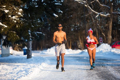 MIKAELA MACKENZIE / WINNIPEG FREE PRESS
Winston Harding (left) and Clemus Laurila celebrate the finish at the end of the New Year's Day Polar Bare Run at Assiniboine Park in Winnipeg on Tuesday, Jan. 1, 2019. 
Winnipeg Free Press 2018.