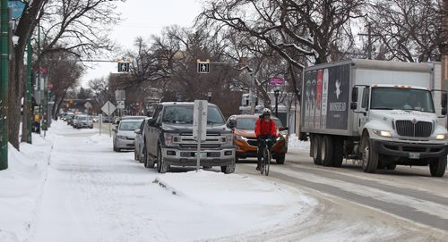 MIKE DEAL / WINNIPEG FREE PRESS
The bike lane on Sherbrook, where nearly every bollard has been removed entirely.
190102 - Wednesday, January 2, 2019