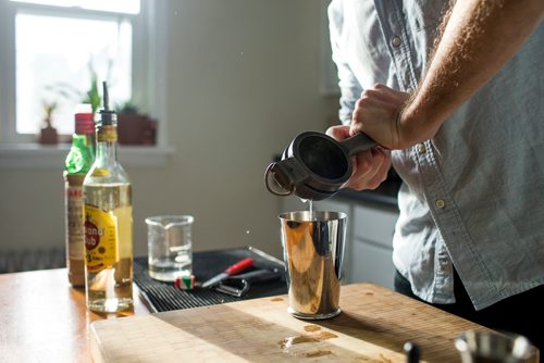 MIKAELA MACKENZIE / WINNIPEG FREE PRESS
Josey Krahn makes a daiquiri at his home bar in Winnipeg on Thursday, Jan. 3, 2019. 
Winnipeg Free Press 2018.