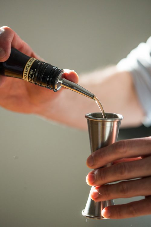 MIKAELA MACKENZIE / WINNIPEG FREE PRESS
Josey Krahn makes an old fashioned at his home bar in Winnipeg on Thursday, Jan. 3, 2019. 
Winnipeg Free Press 2018.