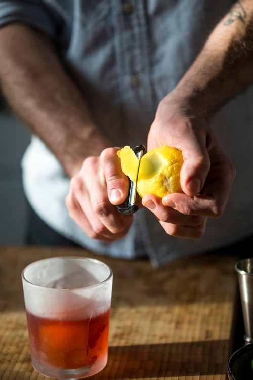 MIKAELA MACKENZIE / WINNIPEG FREE PRESS
Josey Krahn makes a negroni at his home bar in Winnipeg on Thursday, Jan. 3, 2019. 
Winnipeg Free Press 2018.