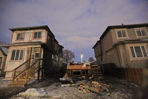 MIKE DEAL / WINNIPEG FREE PRESS
A fire destroyed a house at 905 Manitoba Ave and cause significant damage to the houses on either side of it early Friday morning. Winnipeg Fire Paramedic Service have reported no injuries. 
190104 - Friday, January 4, 2019